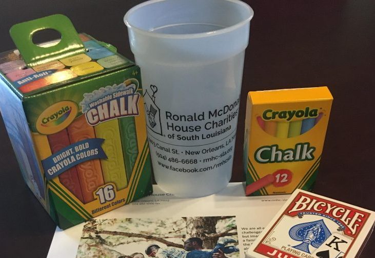 Image of cards, chalk and a RMHC-SLA cup